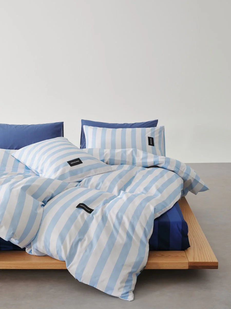 Side angle of Sky Blue & White Striped duvet cover showing wide stripes - RoomDen
