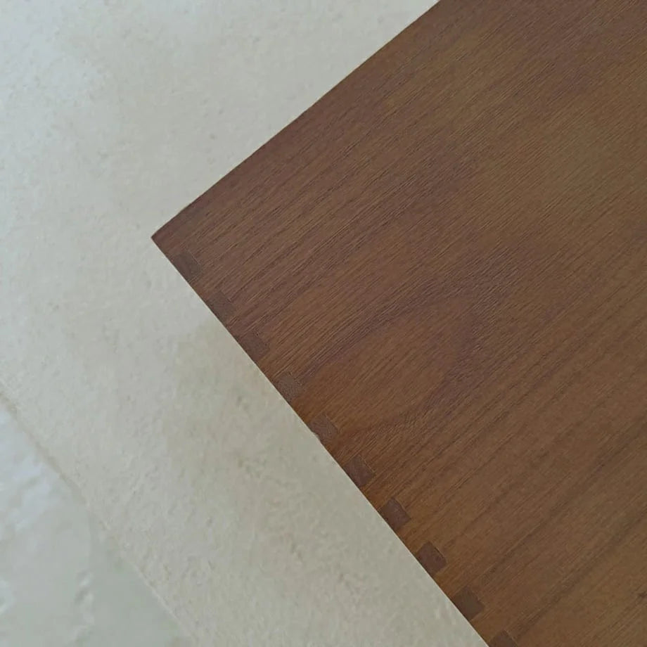 A close-up detail shot of the corner joinery on the wood desktop organizer, showing its craftsmanship. - RoomDen