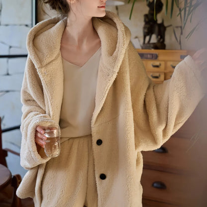 Close-up of the plush texture and hood of the beige flannel fleece pajama top. - RoomDen