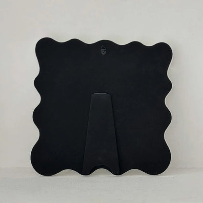 Full view of the back of the mirror, showing both the wall hook and the pop-out stand - RoomDen