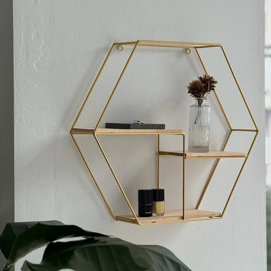Angled view of the Gold Geometric Hexagon Wall Shelf showing its two wooden tiers - RoomDen