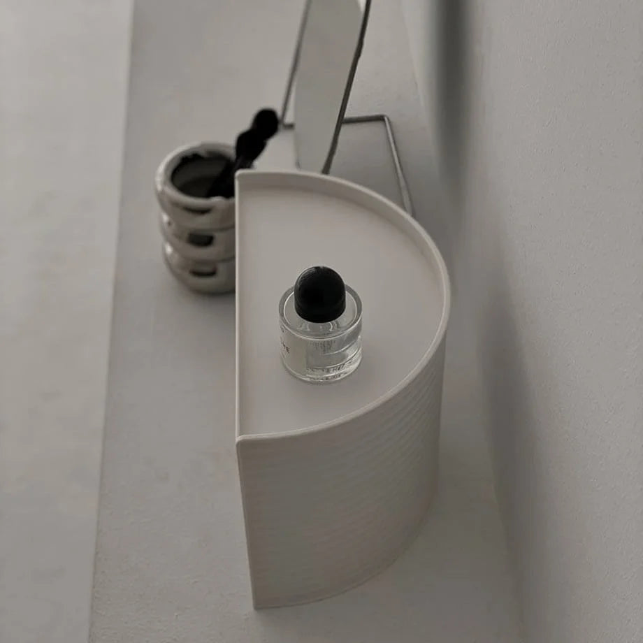 Side profile of the semi-circular makeup organizer, highlighting its slim form factor. - RoomDen