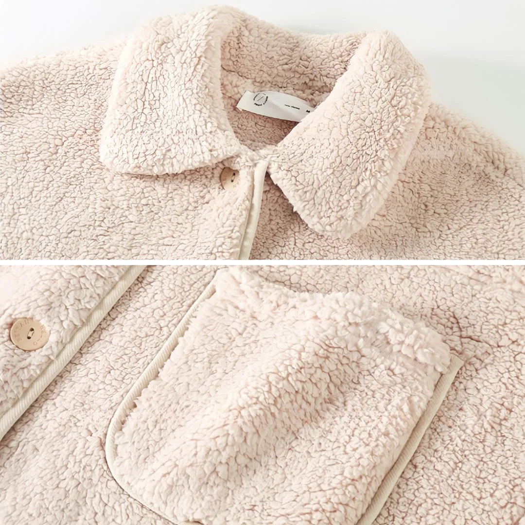 Detail shot of the Creamy Beige Flannel Fleece Pajama top, showing the collar texture and button.