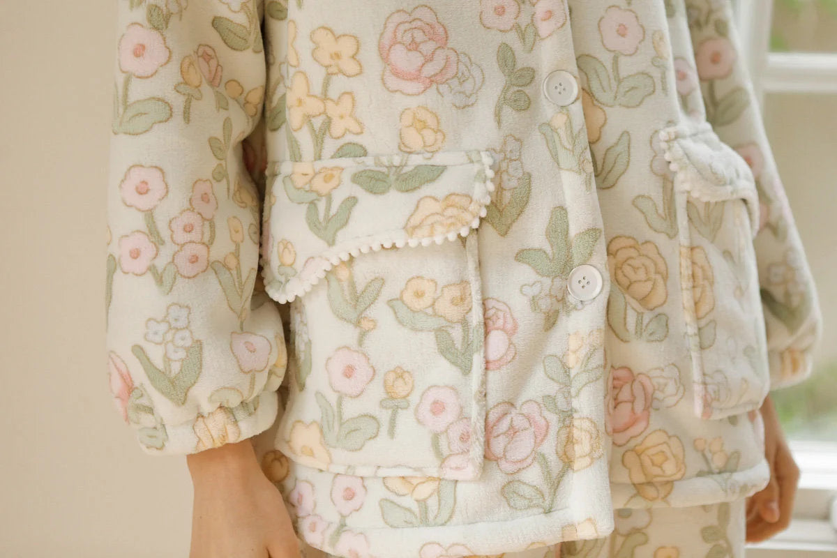 Close up of patch pockets with pom-pom trim on pajama jacket - RoomDen