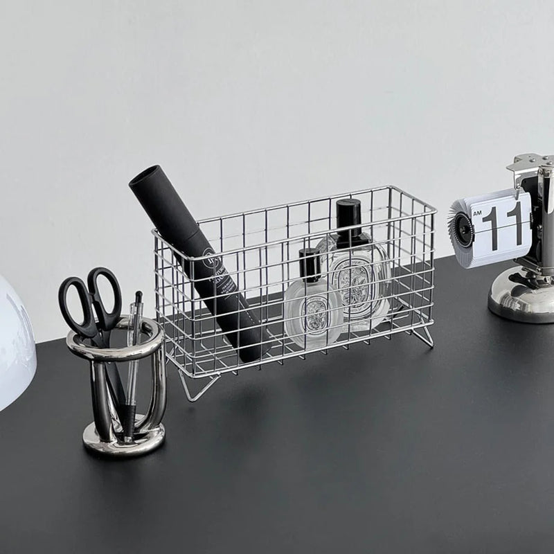 Wireframe Grid Metal Desktop Organizer in chrome silver holding perfume and stationery on a desk. - RoomDen