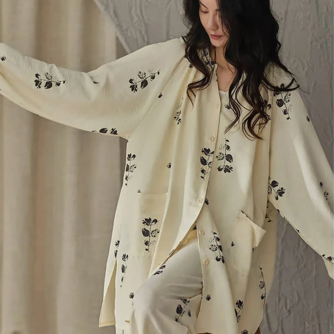 Model showing the flowy, oversized fit and balloon sleeves of the botanical print pajama top - RoomDen