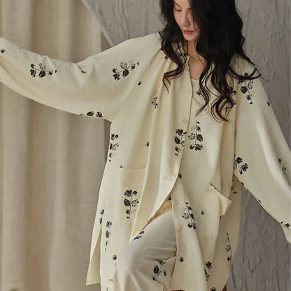 Model showing the flowy, oversized fit and balloon sleeves of the botanical print pajama top - RoomDen