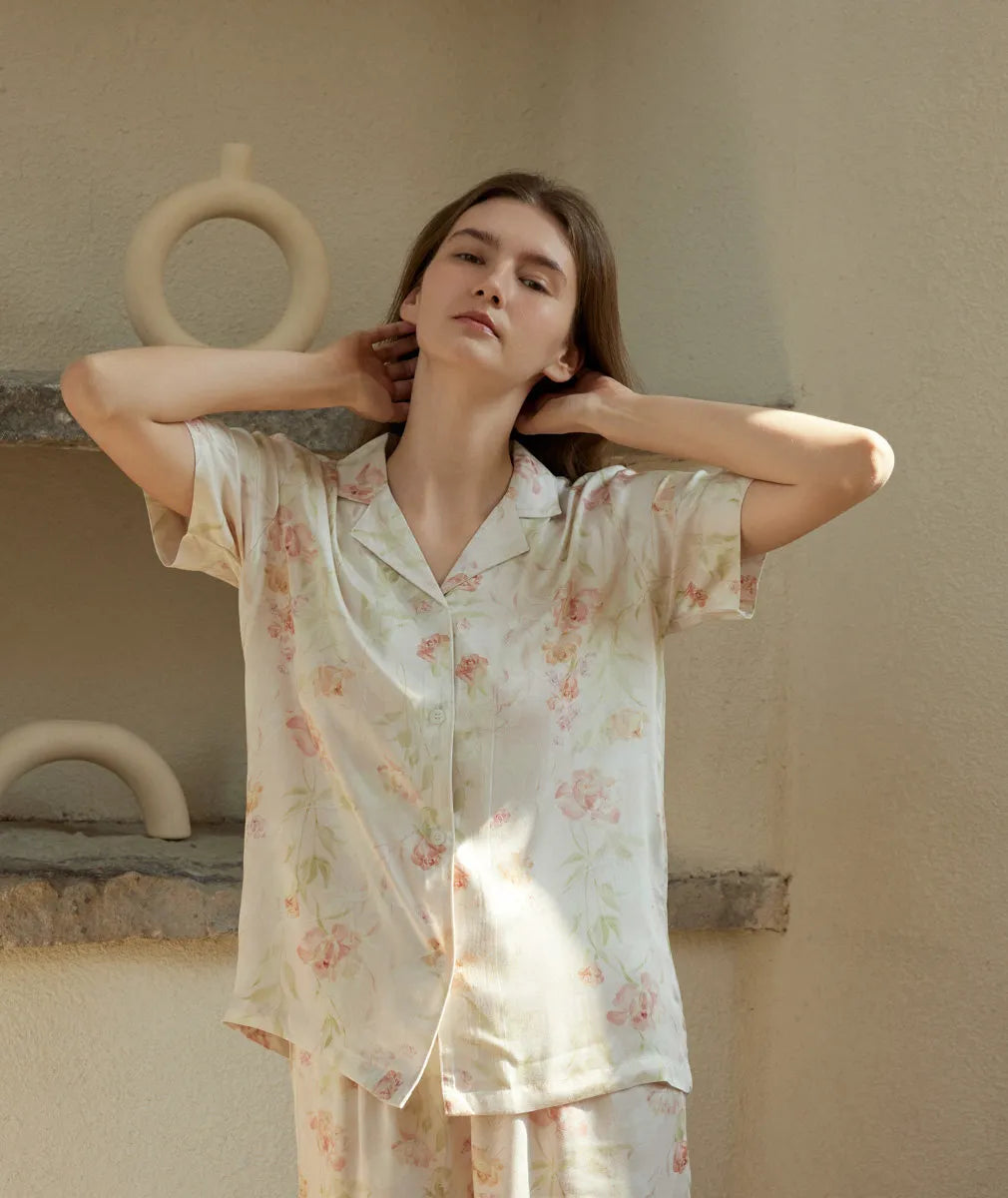 RoomDen Relaxed Fit Floral Pajama - Model with hands behind head relaxing