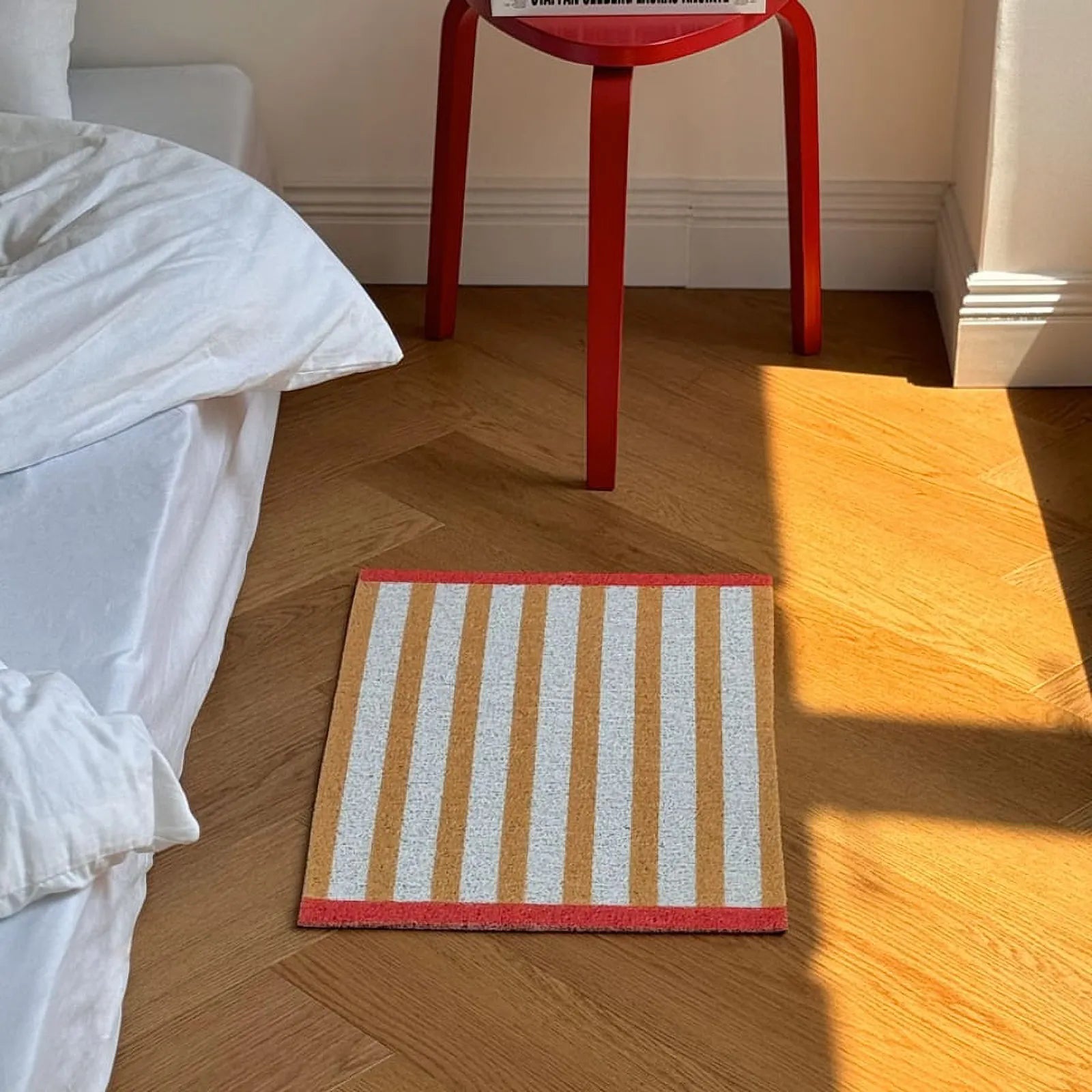 Mustard Yellow Striped mat placed near red stool - RoomDen