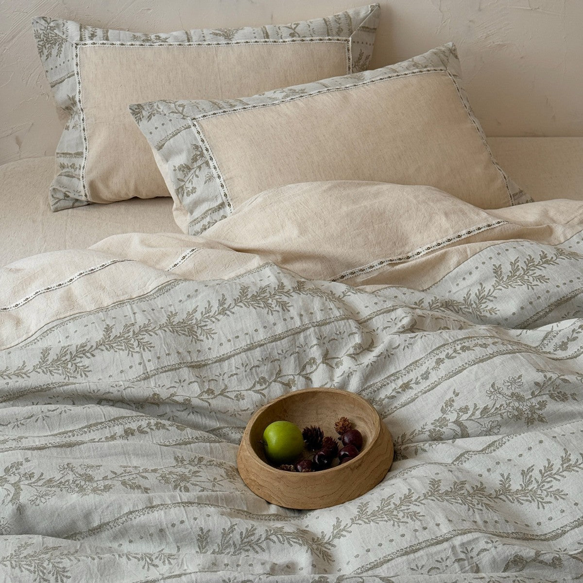 Meriwyn Botanical Linen-Cotton Bedding Set – matching pillows and the botanical duvet with a wooden fruit bowl - Roomden