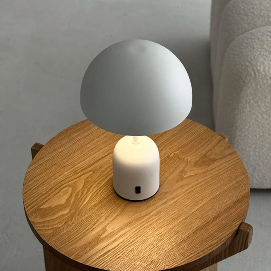 Top-down angle of the Off-White mushroom lamp on a light wood surface - RoomDen