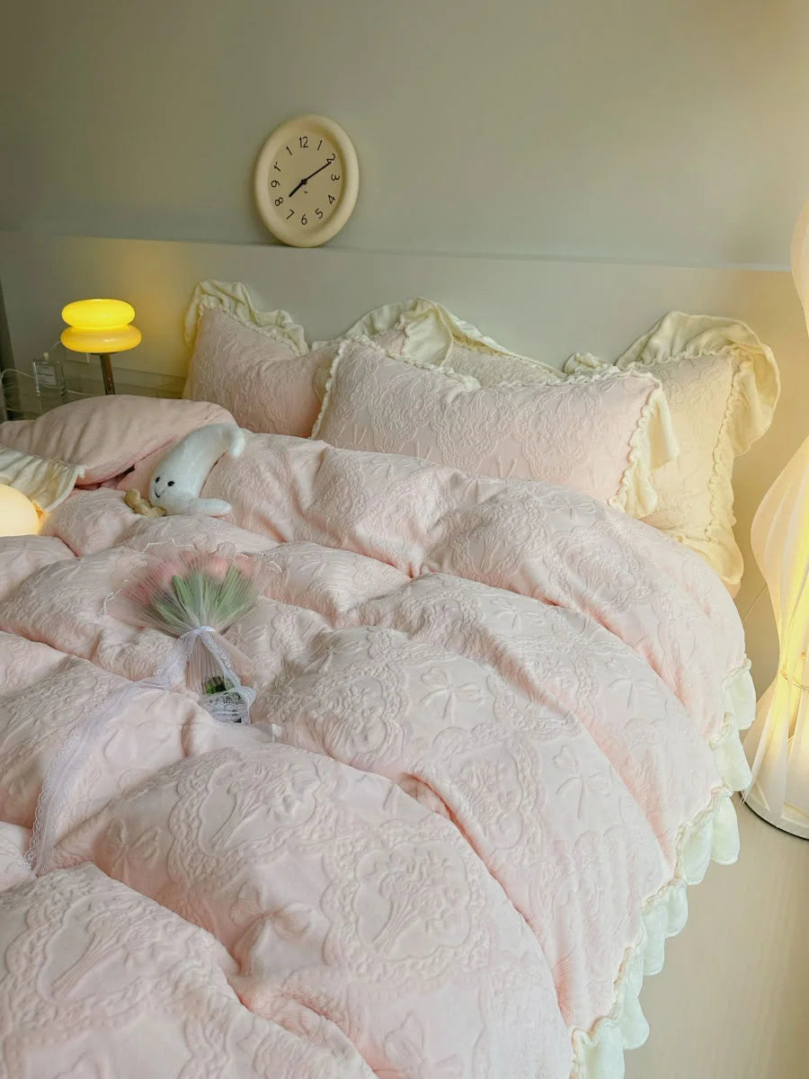Lifestyle image of the Pastel Pink Ruffled Flannel Fleece Bedding Set in a softly lit, cozy bedroom setting - RoomDen.