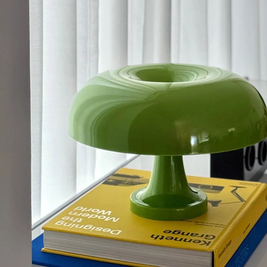 Close-up of the lime green mushroom lamp glowing, highlighting its unique shape - RoomDen.