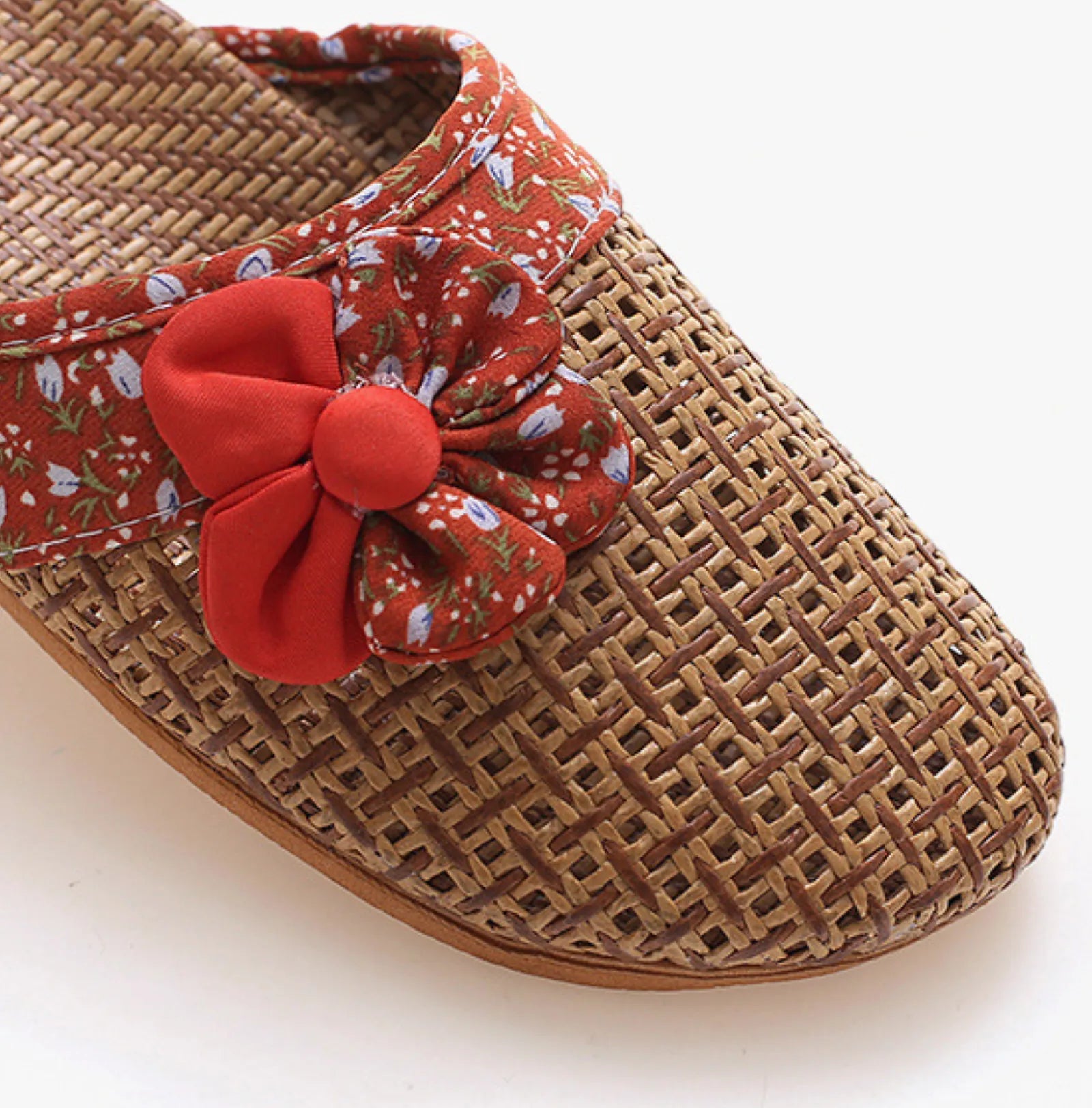 Close up detail of Red Floral Bow on Woven Rattan Slipper - RoomDen