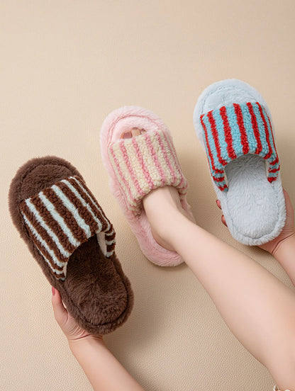 Hand holding Brown and Blue striped slipper with other colorways in background - RoomDen
