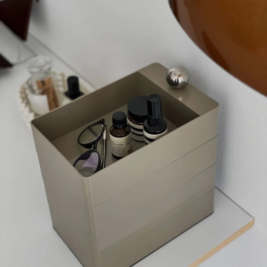 Top view of the Khaki Grey organizer holding skincare bottles and glasses.