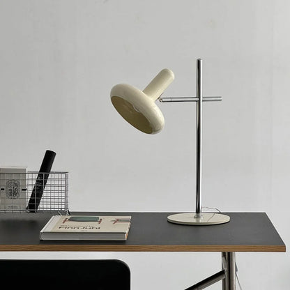 Smooth Sculptural Metal Accent Lamp in Cream on a minimalist black desk - RoomDen.