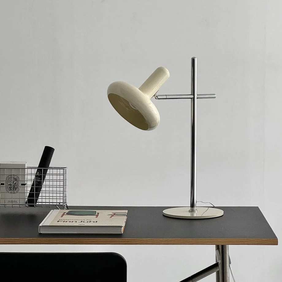 Smooth Sculptural Metal Accent Lamp in Cream on a minimalist black desk - RoomDen.