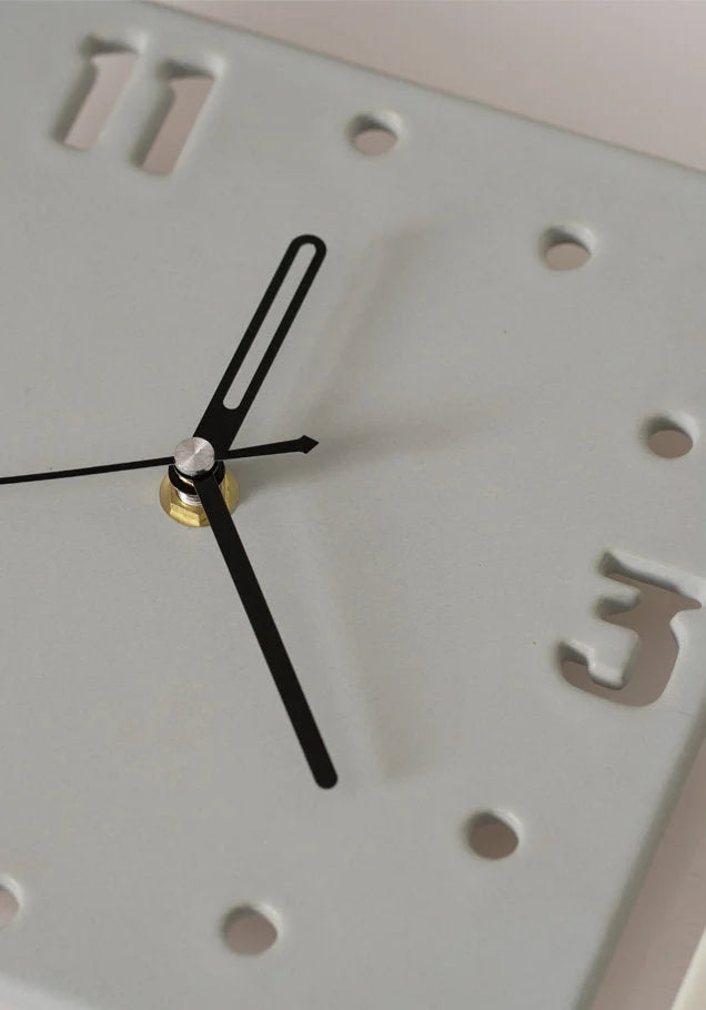 Detail shot of the black hands and cutout number '3' on the Light Grey ceramic clock - RoomDen.