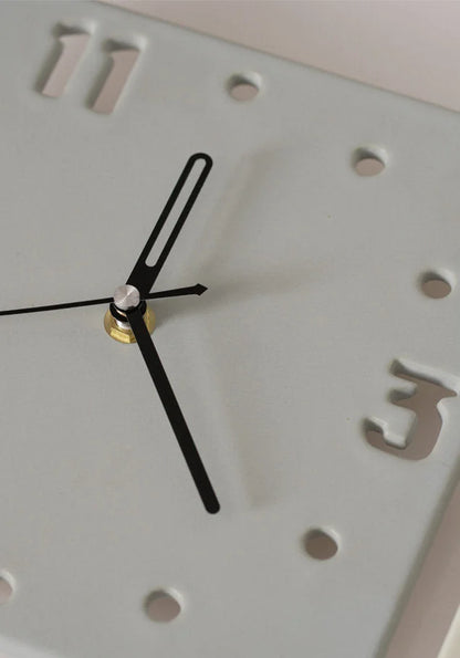 Detail shot of the black hands and cutout number '3' on the Light Grey ceramic clock - RoomDen.