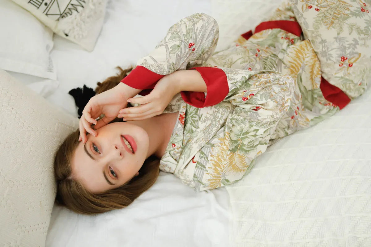 RoomDen Silky Festive Berry Botanical Cotton Sateen Pajama Set - Lying Down Overhead View - Silky Fabric Sheen