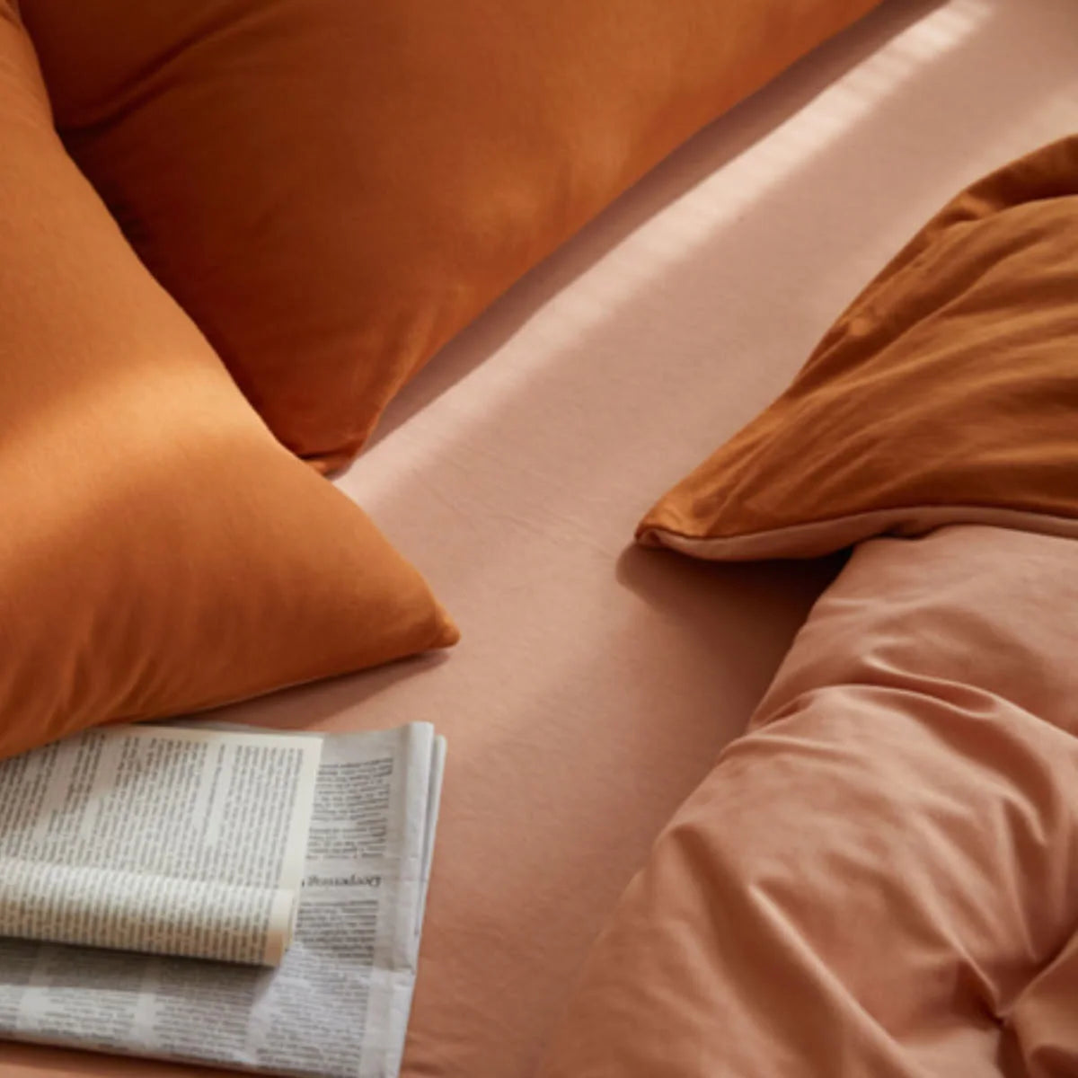 Close-up Texture Shot of Peach and Terracotta Knitted Cotton Fabric - RoomDen
