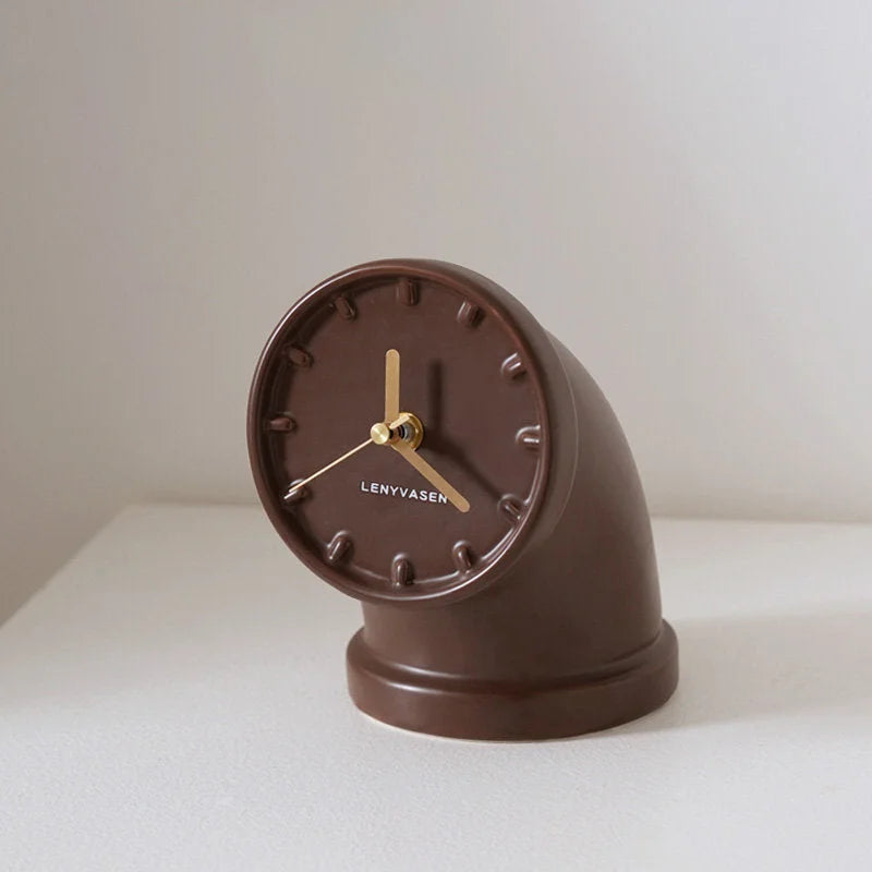 Mocha brown Industrial Pipe Ceramic Table Clock on a white surface, showcasing its rich color - RoomDen
