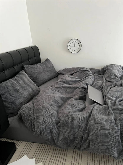 A cozy corner with the Charcoal Grey ruched bedding set, perfect for relaxing and unwinding. - RoomDen