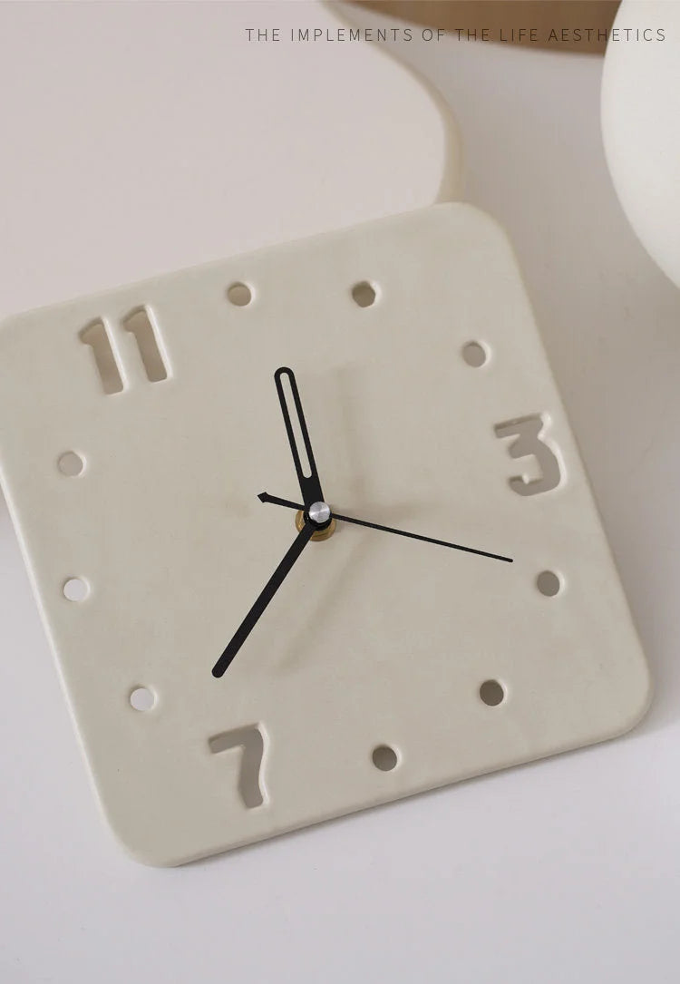 Top-down view of the Cream Minimalist Cutout Ceramic Table Clock on a white surface - RoomDen.