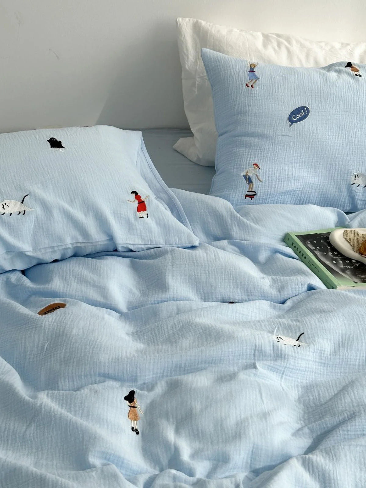 Sky blue version of the whimsical embroidered washed cotton bedding set, showing the duvet cover and pillowcases. - RoomDen