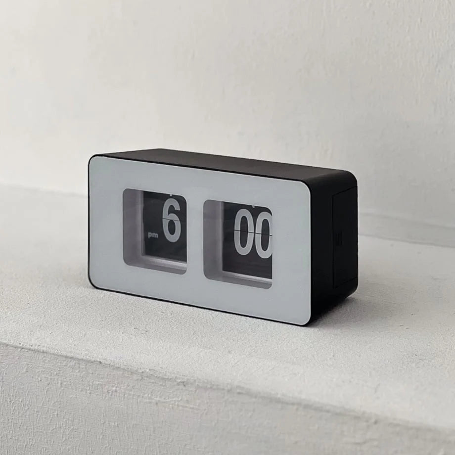Three-quarter view of the black and white retro table clock. - RoomDen