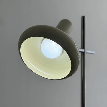 Detail shot of the lamp head illuminated with a cool, bright white light.