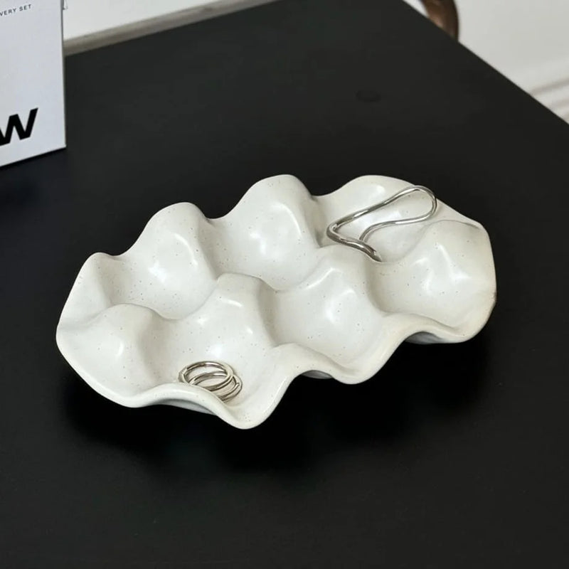 Speckled Wavy Ceramic Jewelry Dish with rings and earrings
