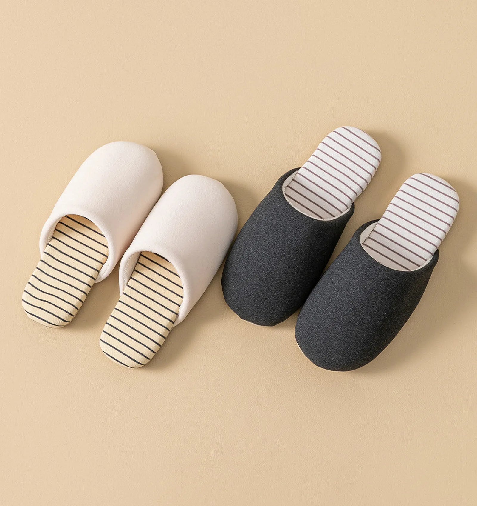 Comparison of white and dark grey cotton house slippers with striped insoles