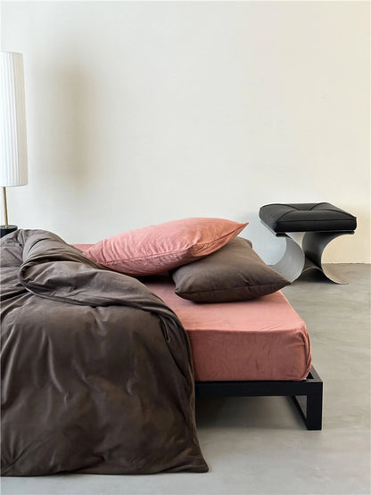 Side view of a bed with the Mocha Brown & Dusty Pink velvet bedding set in a minimalist room. - RoomDen