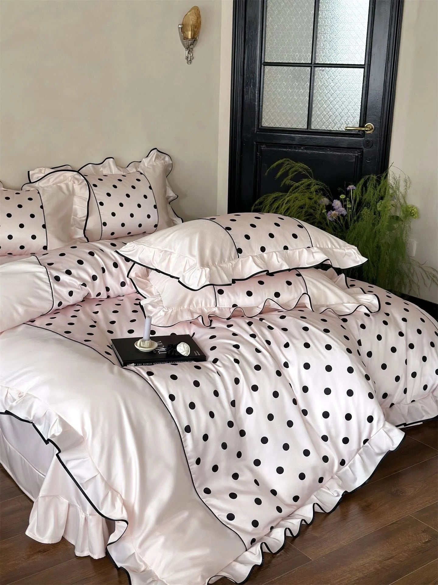 Lifestyle image of the Blush Pink & Black Polka Dot Bedding Set, showing how it drapes on the bed - RoomDen.