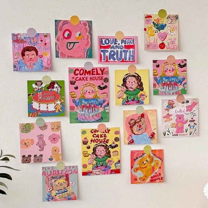 A vibrant wall collage created with the Kawaii Doodle Art Print Set, arranged neatly on a white wall - RoomDen.