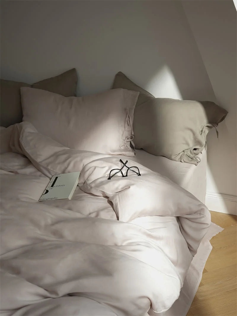 Silky Soft Tie Closure Tencel Bedding Set in Dusty Rose, with sunlight casting a warm glow - RoomDen