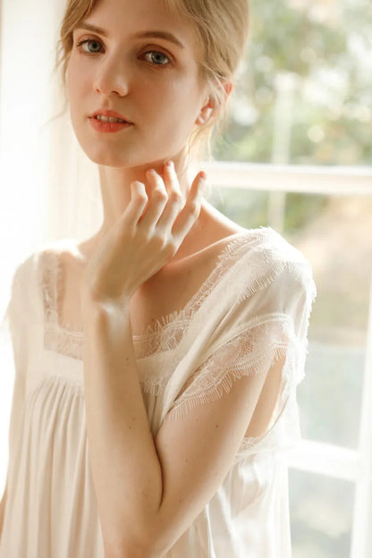 Close up of square neckline and eyelash lace on white pajama dress - RoomDen