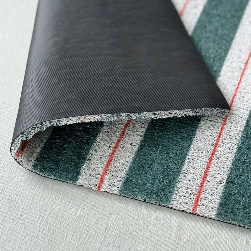 Close up of PVC coil material texture and black non-slip backing rolled up - RoomDen