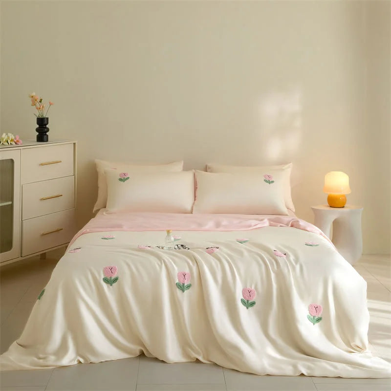 Full view of the Cream & Pink Tufted Doodle Flower Tencel Bedding Set on a bed. - RoomDen