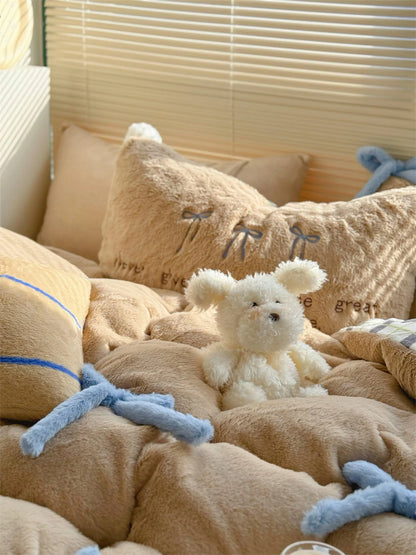 A cute white plush toy sitting on the Khaki Brown Bear bedding set. - RoomDen