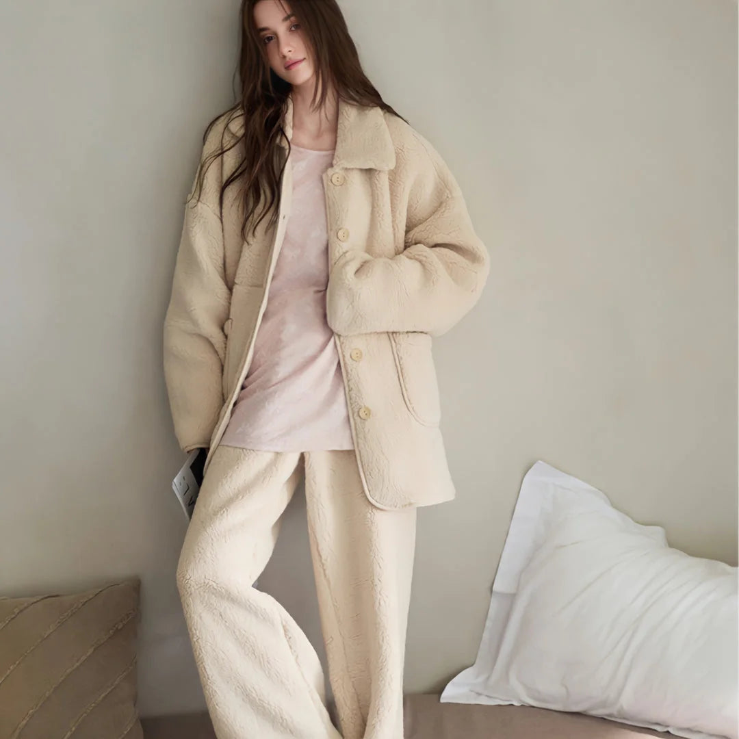 Full-length view of the model wearing the Creamy Beige Fleece Pajama Set with a pink shirt underneath.