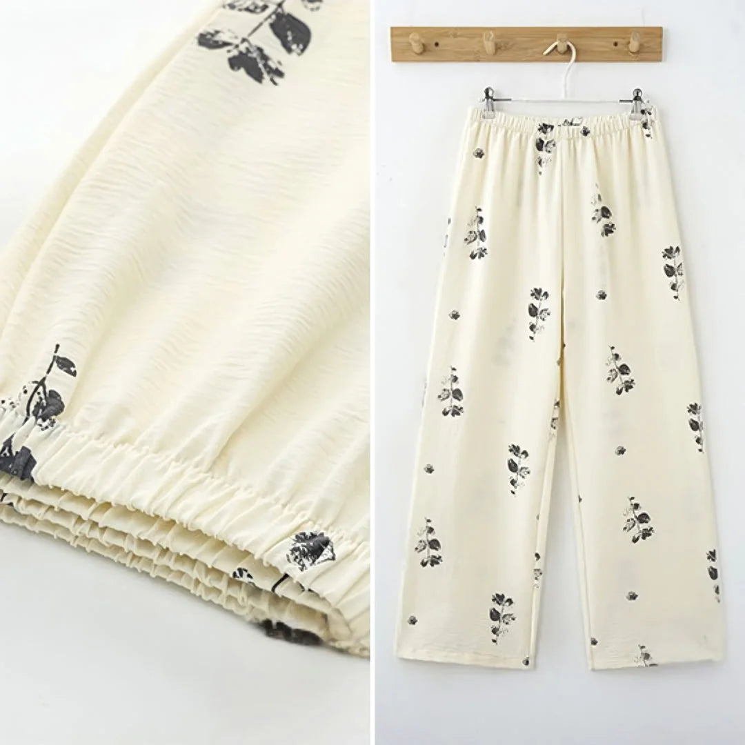 Split image showing close-up of the elastic waistband and a full view of the botanical print pajama pants - RoomDen