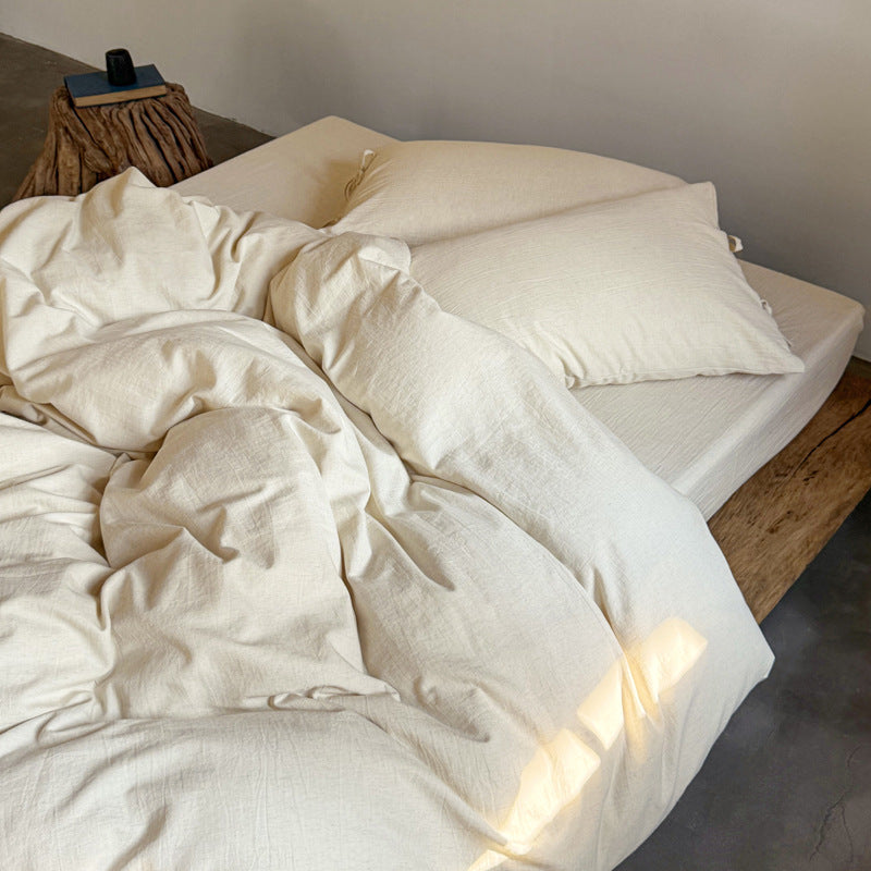 Ashfield Natural Ivory Bedding Set – High angle of softly folded ivory bedding - Roomden