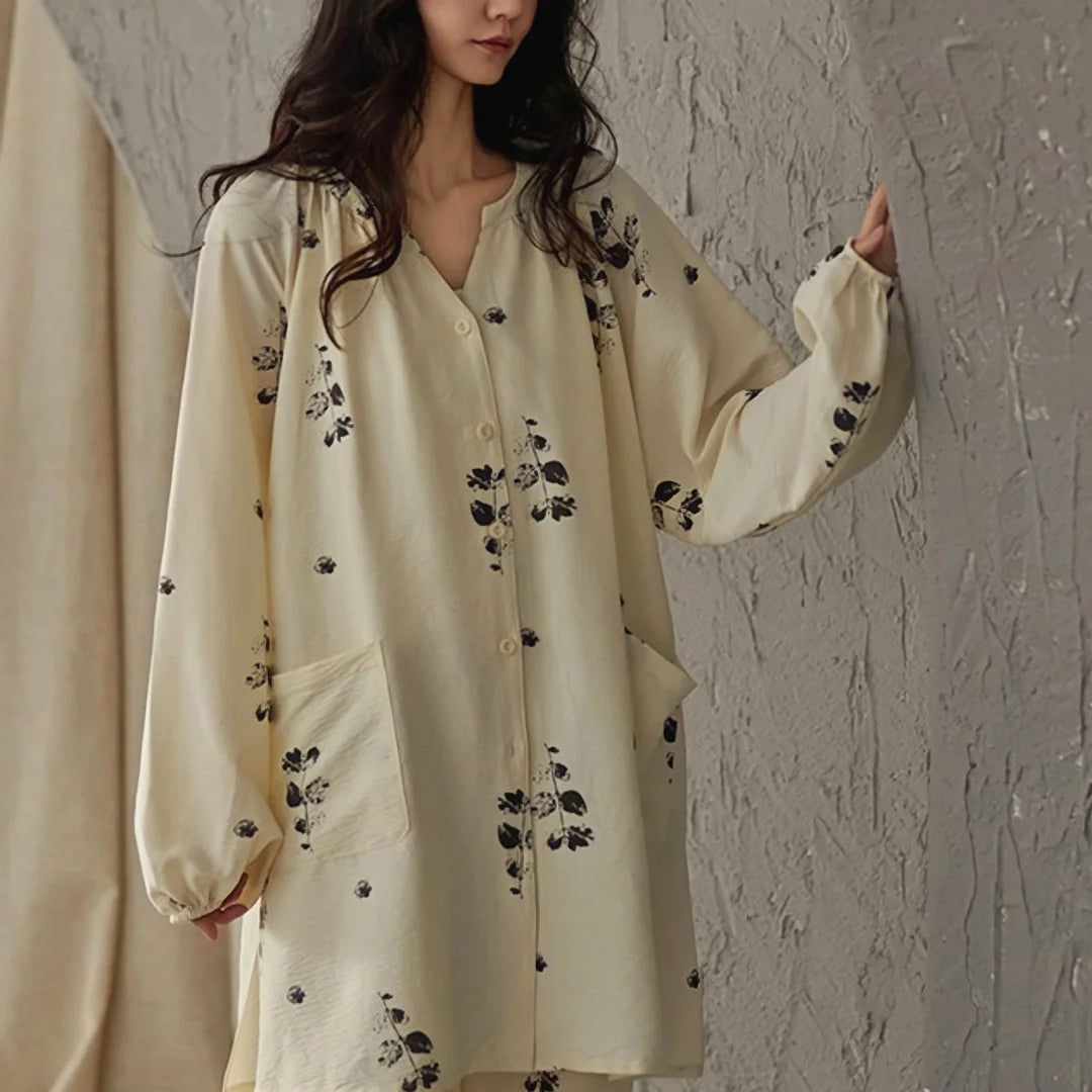 Front view of the botanical print pajama top showing the V-neck, button details, and front pockets - RoomDen
