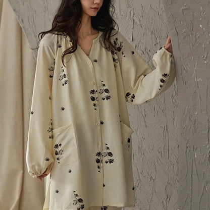 Front view of the botanical print pajama top showing the V-neck, button details, and front pockets - RoomDen