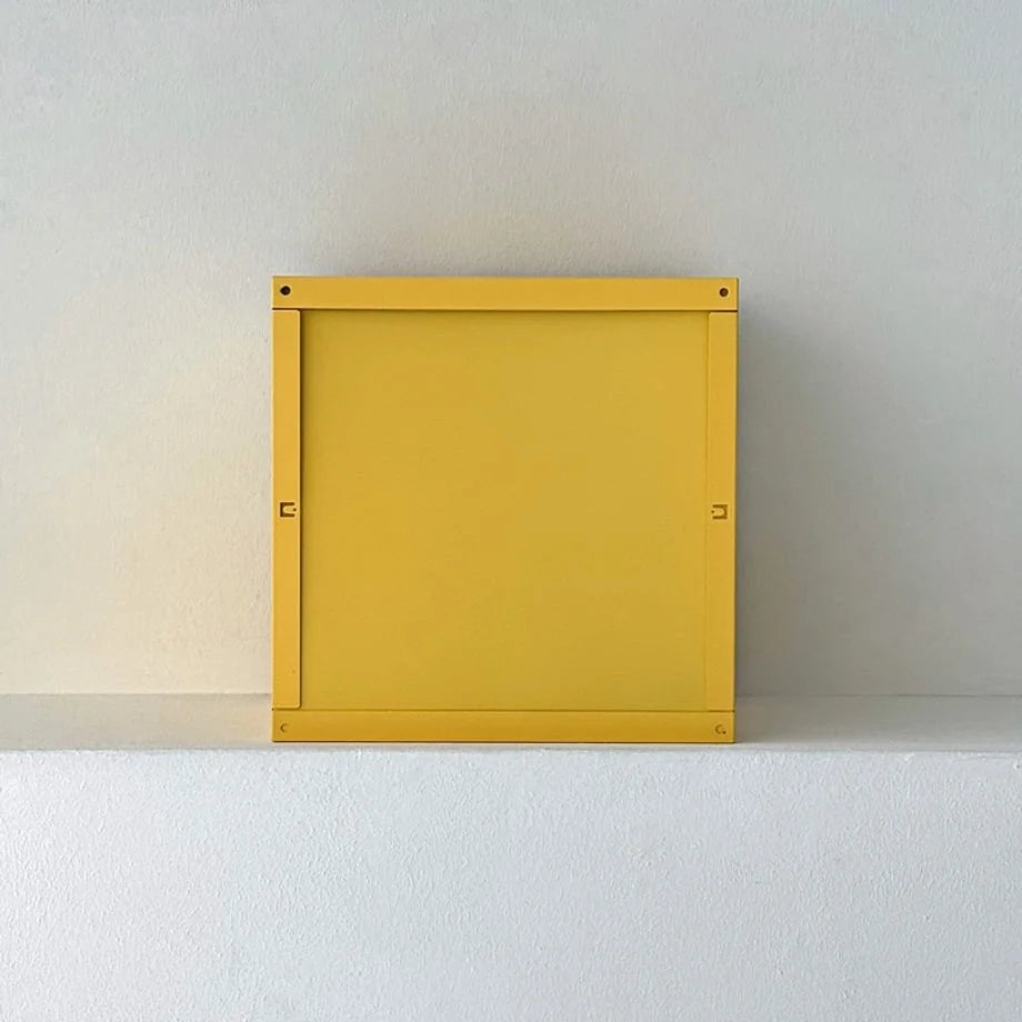 Top-down view of the Sunny Yellow metal desktop organizer showing its square shape - RoomDen.