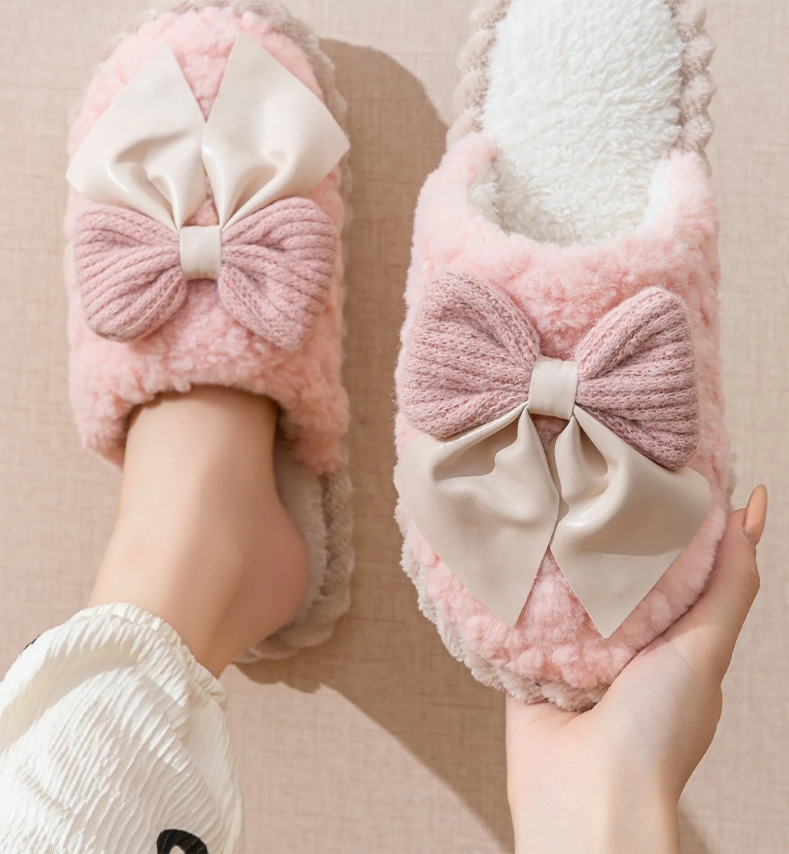 Model wearing Pink fuzzy bow slippers on wood floor - RoomDen