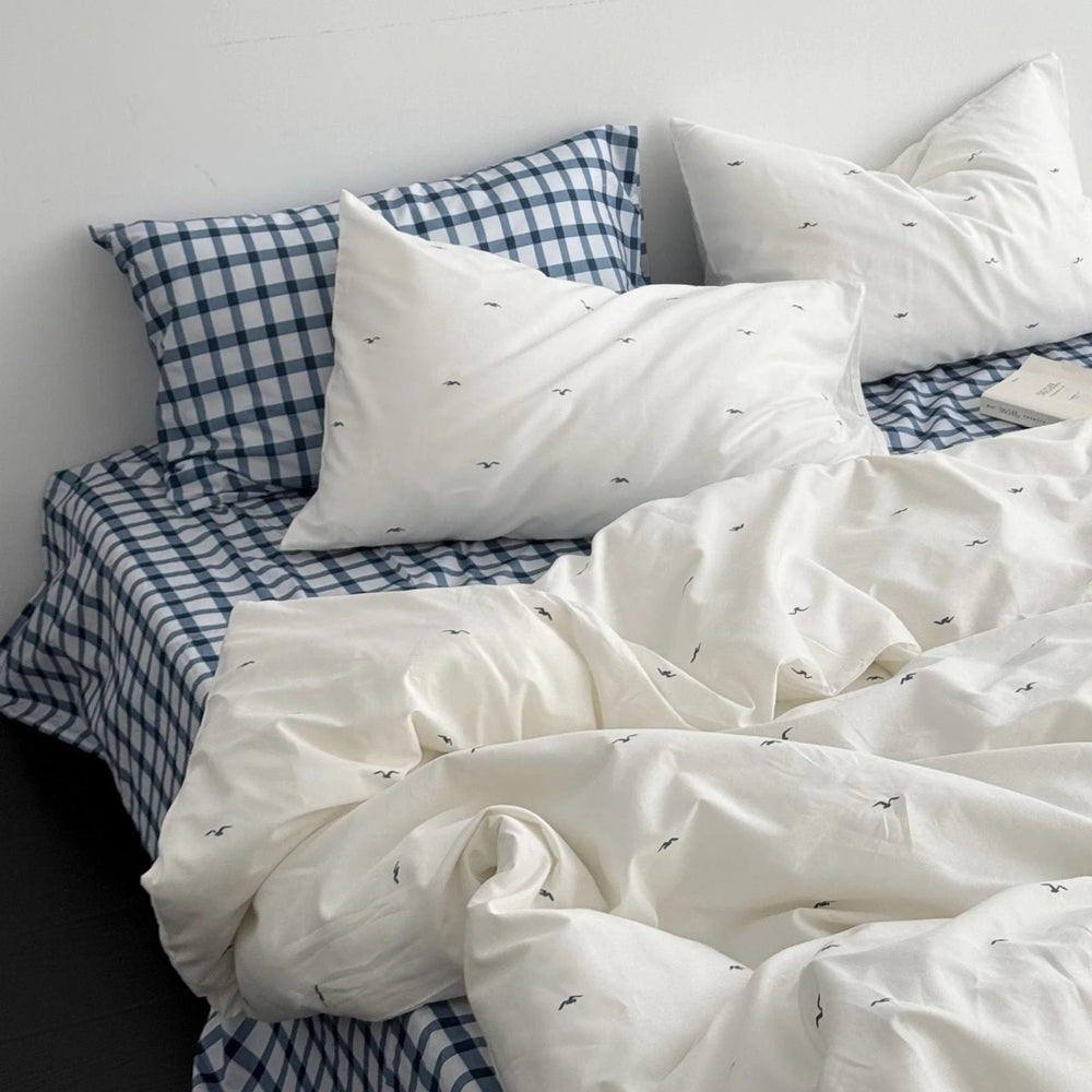 Messy bed view of the Gingham & Seagull Embroidered Washed Cotton Bedding Set - RoomDen